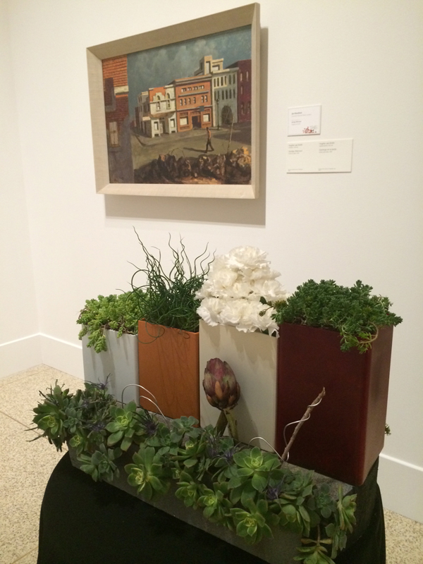 Jim Mumford's "Art Alive" floral design interprets the painting "Sunday Afternoon" by Hughie Lee-Smith.