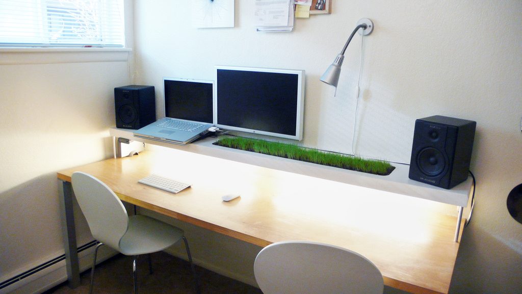 This office desk space is clean but not sterile with the clever desk planter. Photo: Nicholas Todd/Flickr
