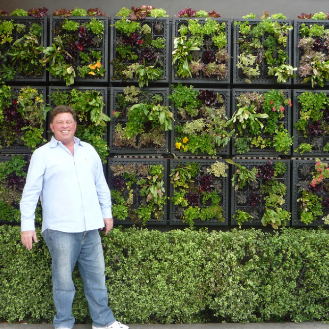 Jim Mumford standing in front of edible wall at Pizzeria Mozza in Hollywood, California.