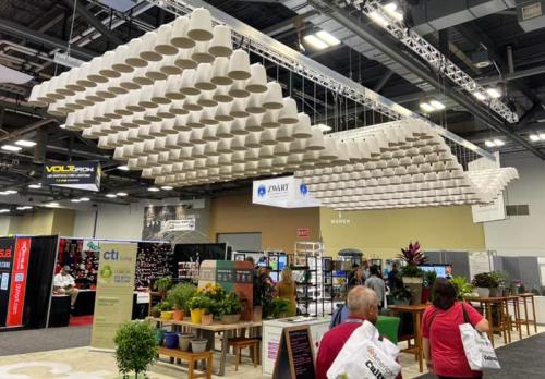 Good Earth Plant Company likes making use of overhead space to create "overhead moments." We love this decorative hanging sculpture, which hides the unattractive ceiling fixtures. Great idea! Photo: Jim Mumford Cultivate 22