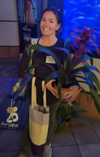 Good Earth Plant Company's donated orchids and bromeliads were "adopted" and went home with happy party attendees.